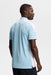 J.Lindeberg Bo Polo Golf Shirt in light blue on model facing away showing the back of the polo