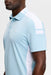 J.Lindeberg Bo Polo Golf Shirt in light blue on a model showing the logo clearly