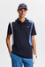 J.Lindeberg Legacy Golf Polo Shirt in navy with blue and white detail on model facing forwards showing front of shirt