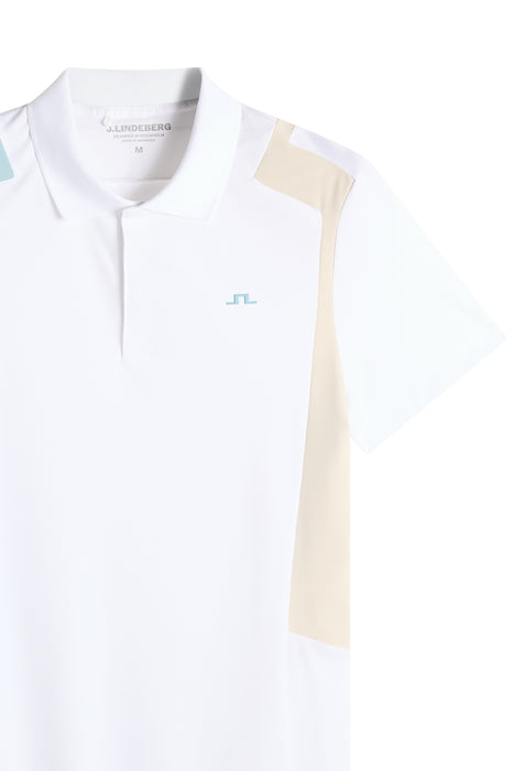 J.Lindeberg Legacy Golf Polo Shirt in white beige and light blue, close up of polo showing badge clearly