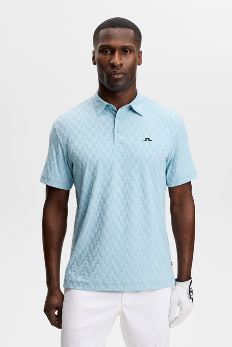 J.Lindeberg Kofe Golf Polo Shirt - in light blue on model facing forwards showing front of shirt