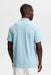J.Lindeberg Kofe Golf Polo Shirt in light blue on model who is facing away showing the back of the shirt