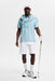 J.Lindeberg Kofe Golf Polo Shirt in light blue on model who has matching colour sweatshirt tied round neck