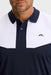 close up of the J.Lindeberg Calex Golf Polo Shirt on model in white and navy