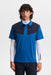 J.Lindeberg Calex golf polo shirt in blue and navy with a classic collar, worn over a white long-sleeved base layer.