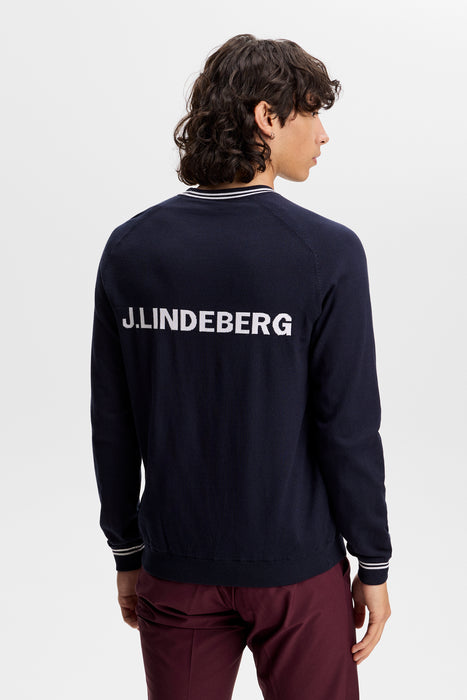back of the J.Lindeberg Kenny Windbreaker Knit Golf Sweatshirt in navy on male model