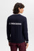 back of the J.Lindeberg Kenny Windbreaker Knit Golf Sweatshirt in navy on male model