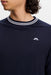 close up on model of the J.Lindeberg Kenny Windbreaker Knit Golf Sweatshirt in navy