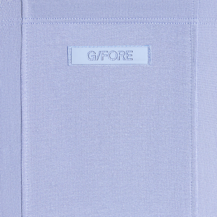 G/FORE All Play Terry Golf Hoodie in light blue, close up of gfore logo on the hood