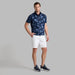 G/FORE Double Knit Camo Golf Gilet in navy camo on model wearing white shorts and gfore shoes