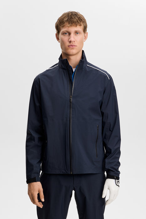 navy J.Lindeberg Shay Rain Waterproof Golf Jacket on a male model