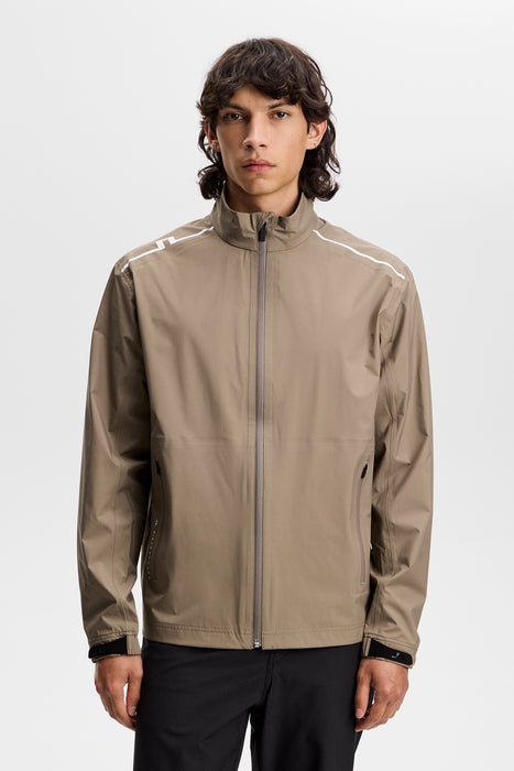 J.Lindeberg Shay Rain Waterproof Golf Jacket in beige on model