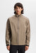 J.Lindeberg Shay Rain Waterproof Golf Jacket in beige on model