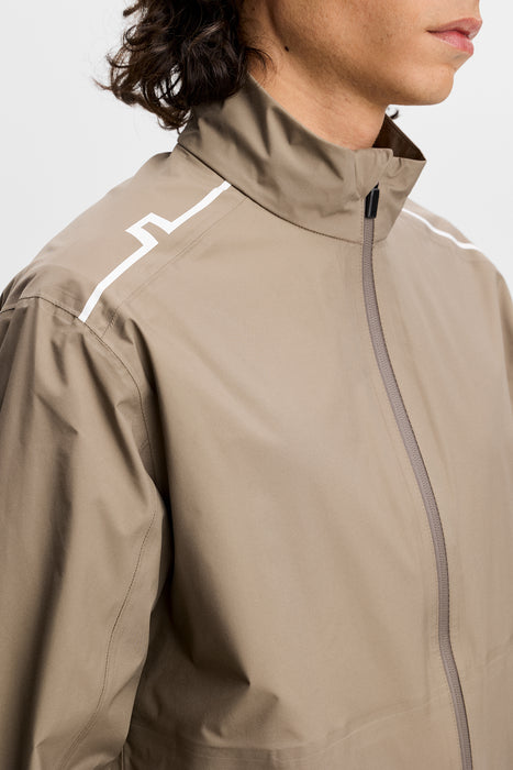 J.Lindeberg Shay Rain Waterproof Golf Jacket in beige on model close up