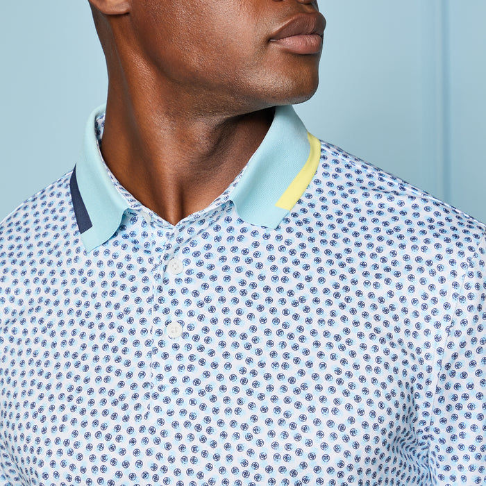close up of collar on the G/FORE Triple/G Tech Jersey Golf Polo Shirt in blue and yellow