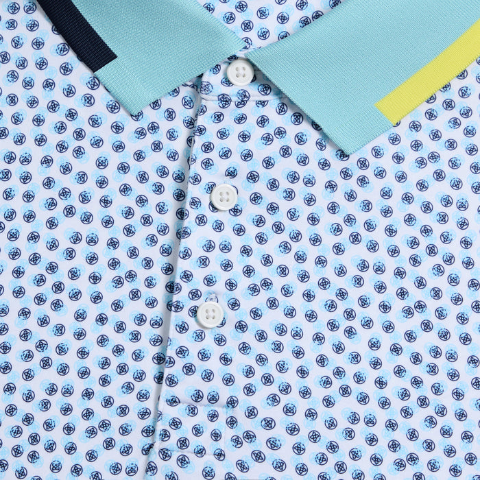 close up of buttons on the G/FORE Triple/G Tech Jersey Golf Polo Shirt in white/blue/yellow