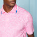 G/FORE Fireworks Tech Jersey Golf Polo Shirt in blush pink on a model close up
