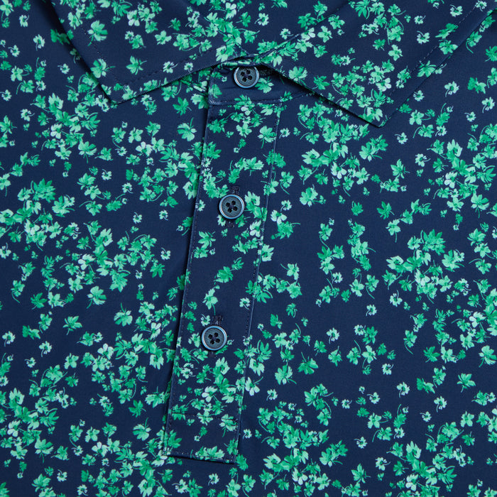 G/FORE Scattered Ditzy Tech Jersey Golf Polo Shirt, close up of the buttons and green floral design