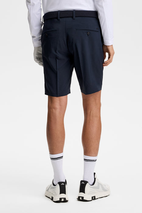 J.Lindeberg Mitch Golf Shorts in navy on model showing rear of shorts