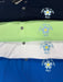 Stacked PING Lindum Fore Get Me Not golf polo shirts in navy, lime, white, and blue with embroidered flower detail.