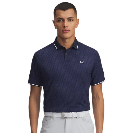 Man wearing a navy patterned polo shirt with white accents on a light gray background