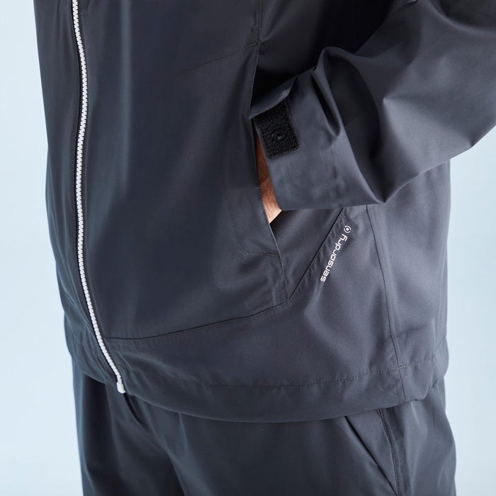 Black jacket with a zipper and brand logo on a light blue background