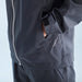 Black jacket with a zipper and brand logo on a light blue background