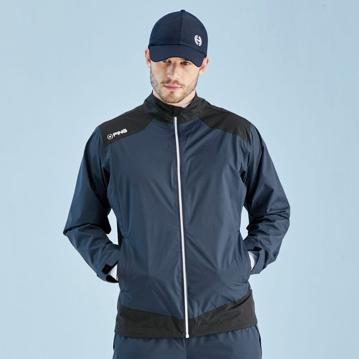 Front view of a navy and black PING AquaDrive waterproof golf jacket with a full-length zip and high collar.