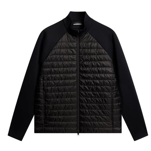 Black quilted jacket on a white background