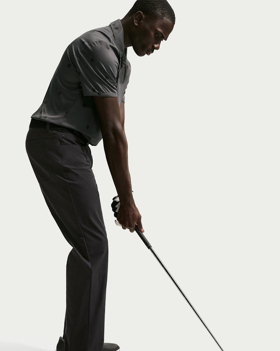 Nike Velocity 5 Pocket Golf Trousers  on model who is hitting a golf shot