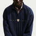 Nike Fairway Fresh Golf Half Zip Sweatshirt in navy close up of nike branding on front
