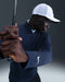 Nike Velocity ThermaFit Golf Half Zip Sweatshirt in navy, close up of the golfer hitting a shot, showing the nike logo