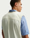 Nike Fairway Fresh Oversized Golf Wind Vest (2026) in beige and white, back of the model