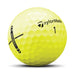 Yellow golf ball with TaylorMade logo on a white background
