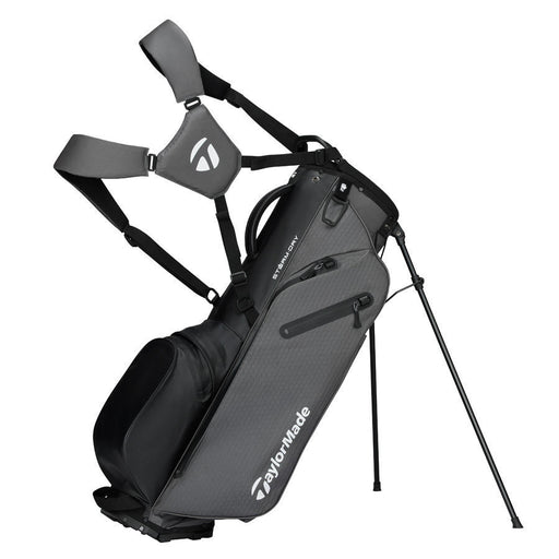 TaylorMade Storm Dry Waterproof Golf Stand Bag in grey black on its stand showing straps