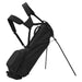 TaylorMade FlexTech Carry Golf Stand Bag in all black, on its stand showing large pocket and back straps