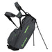  in TaylorMade FlexTech Crossover Golf Stand Bag in grey and green, on its stand with straps in the air