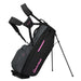 TaylorMade FlexTech Crossover Golf Stand Bag in black grey and pink, on its stand showing largest pocket