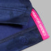 Navy blue fabric with a pink 'Pray for Birdies' tag on a grey background