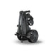 The Motocaddy M7 Remote Electric Golf Trolley in its folded state on its stand