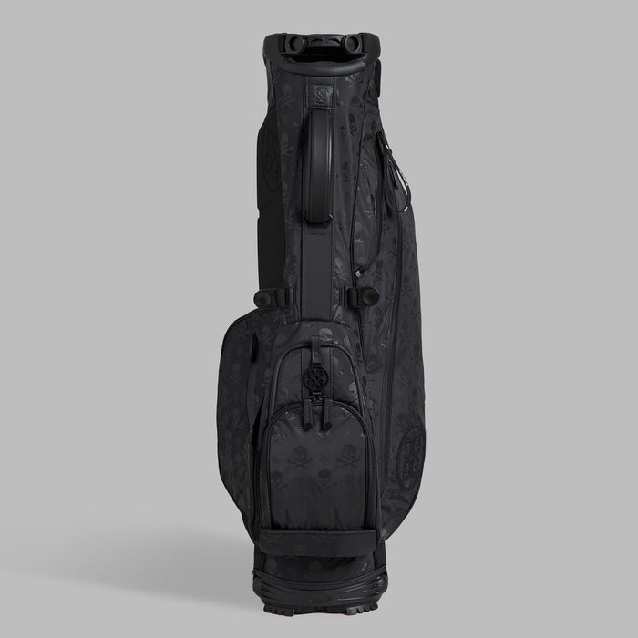 ball pocket and carry handle of the G/FORE Scrambled Skull & Tees Parachute Golf Stand Bag in black