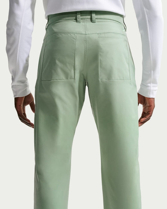 green Nike Velocity 5 Pocket Golf Trousers on model facing away
