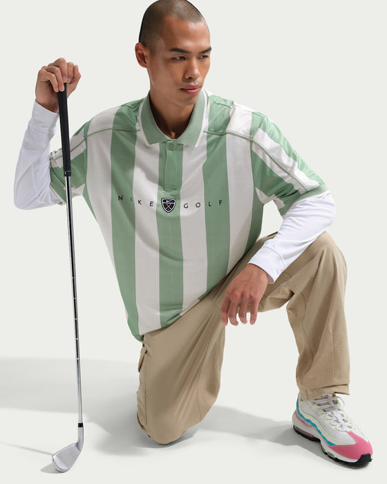 Nike Dri-FIT Fairway Fresh Loose Golf Polo Shirt in green and white stripes on male model holding golf club