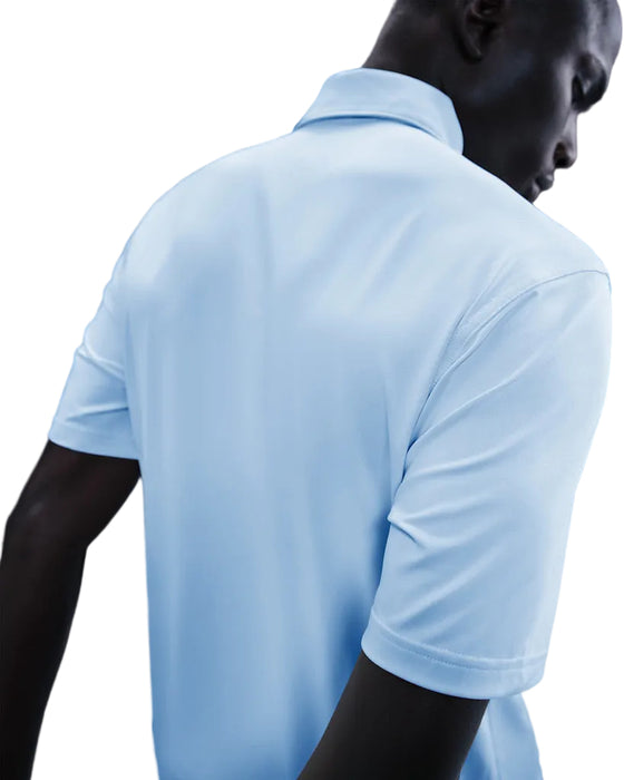 back of a male model wearing the Nike Velocity Solid Golf Polo Shirt in blue