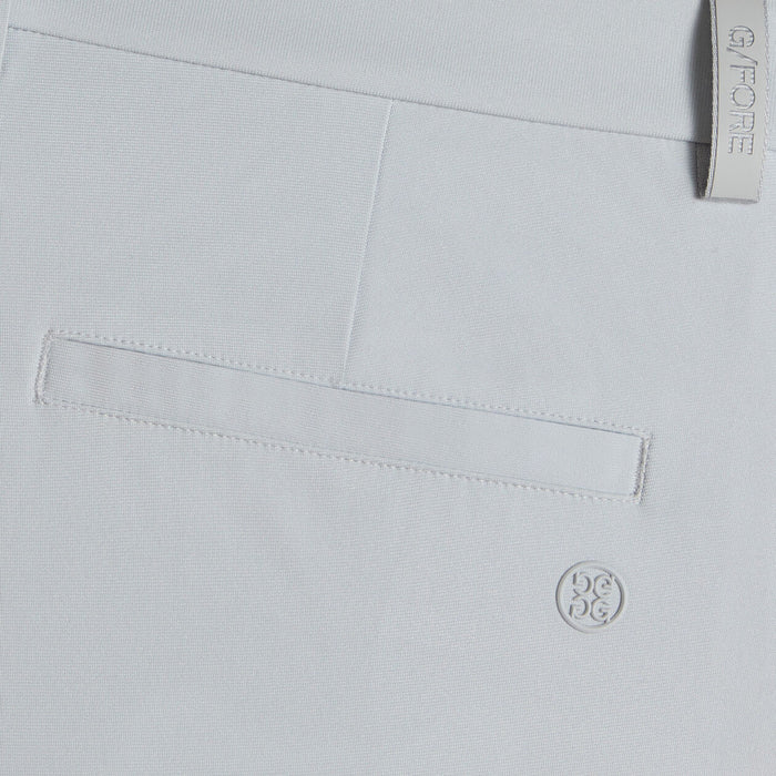 G/FORE Tour Golf Shorts in grey, close up of logos and back pocket