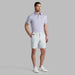 man wearing the new G/FORE Tour Golf Shorts in grey 