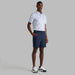 G/FORE Tour Golf Shorts in navy on man wearing g/fore shirt and shoes