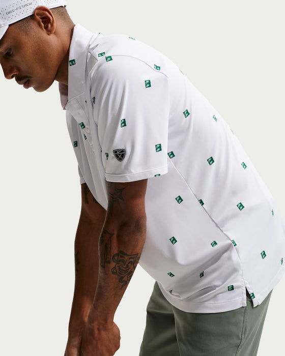 male golfer addressing the ball in the Nike Dri-FIT Par 5 Golf Polo Shirt in white with green