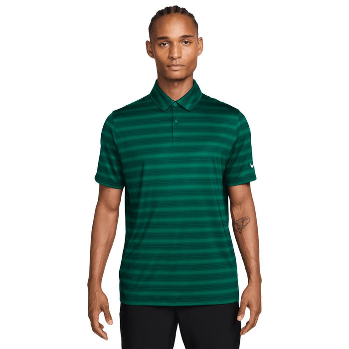 Man wearing a green Nike Velocity Dri-FIT Stripe Golf Polo Shirt on a white background