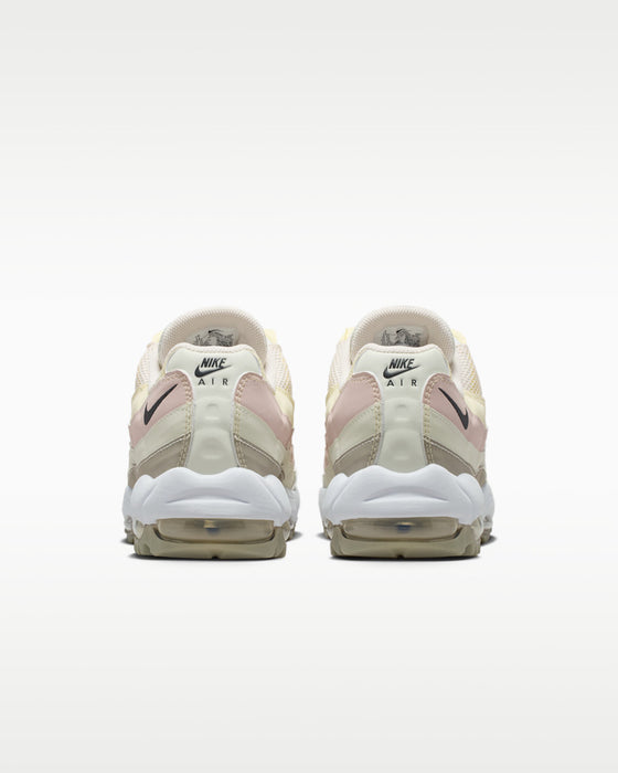 heels of the pair of Nike Air Max 95 G Golf Shoes in beige white and yellow